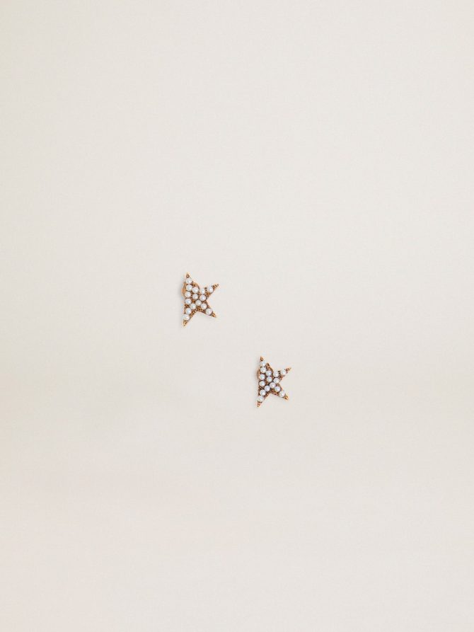 Women’s stud earrings in antique gold color with decorative beads