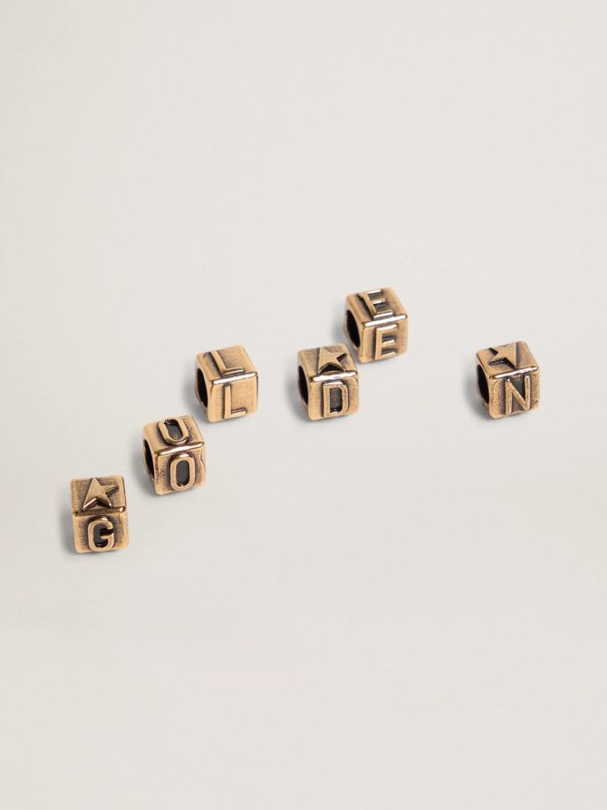 Women’s cubic charms in antique gold color with letters of the alphabet