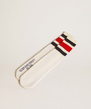 Worn-white socks with distressed details and black and red stripes