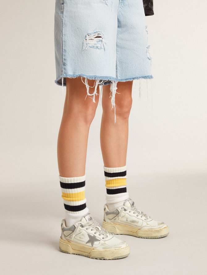 Worn-white socks with distressed details and black and yellow stripes - Image 4