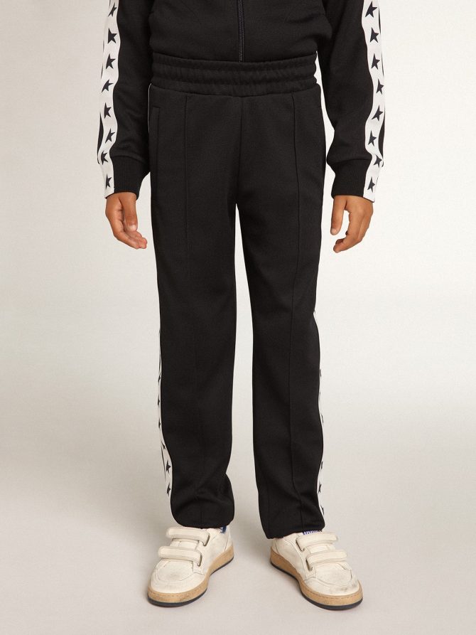 Dark blue joggers with white strip and contrasting stars - Image 3