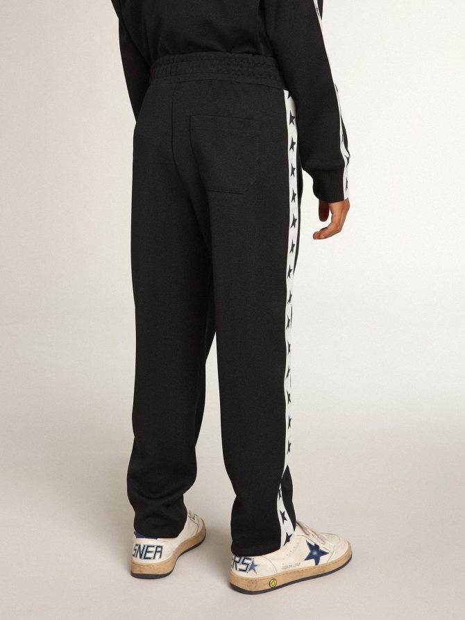 Dark blue joggers with white strip and contrasting stars - Image 5