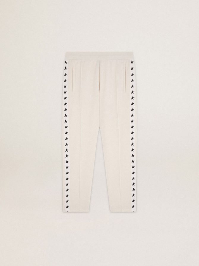 Men’s white joggers with black stars on the sides