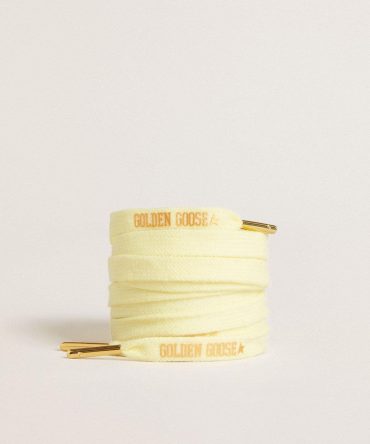 Yellow cotton laces with contrasting gold-colored logo