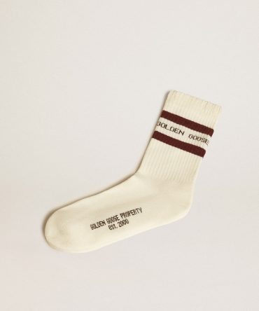 Worn-white socks with distressed details and brown stripes