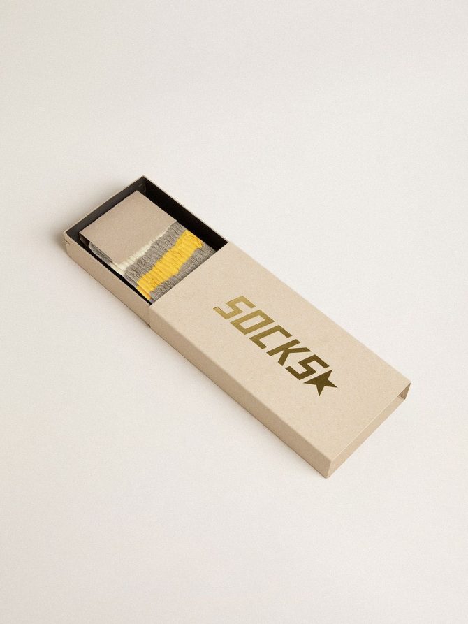 Gray socks with distressed details and yellow and white stripes - Image 2