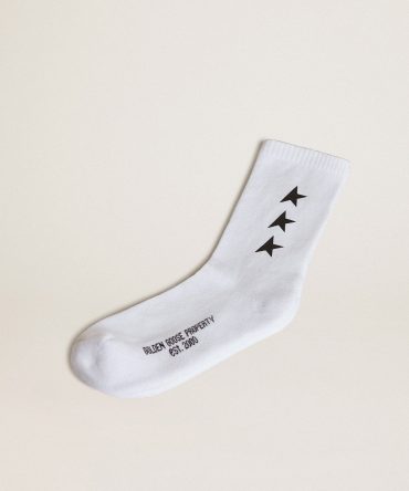 Worn white socks with contrasting black stars