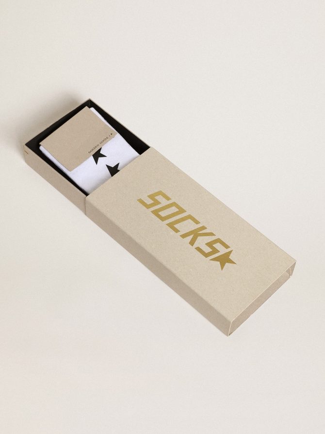Worn white socks with contrasting black stars - Image 2