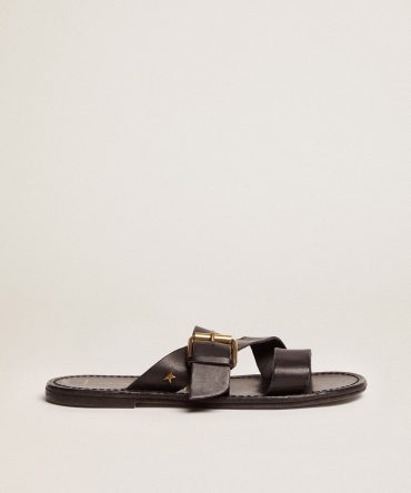Margaret flat sandals in black resin-coated leather