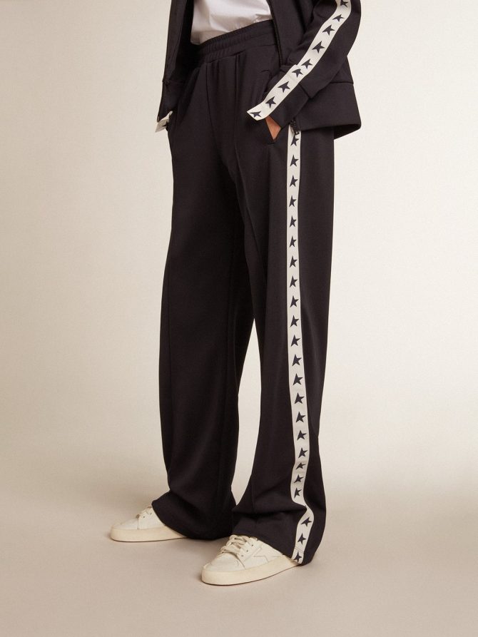 Dark blue joggers with white strip and contrasting stars - Image 2
