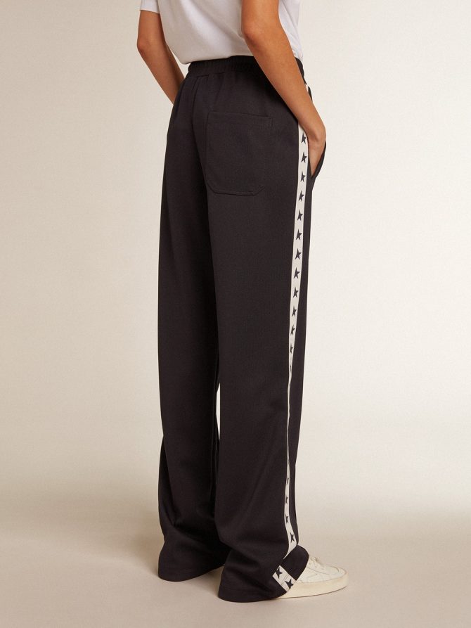 Dark blue joggers with white strip and contrasting stars - Image 4