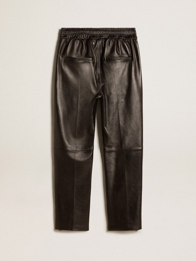 Black joggers in nappa leather with zip at the base